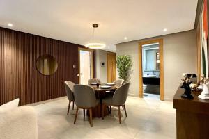 a dining room with a table and chairs at State of Peace in Marina - By AppartAli in Casablanca-Port +44 photos