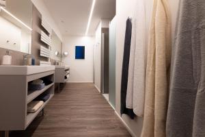a bathroom with a vanity and a sink at Lorenzhaus Exclusive Residence in Sankt Lorenz +42 photos