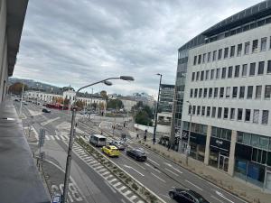 a busy city street with cars and a building at Urban stay Bratislava City in Bratislava