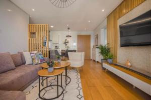 a living room with a couch and a table at La Terrazza at Marina - By AppartAli in Casablanca-Port