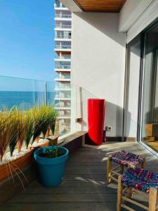 a balcony with a view of the ocean on a building at Marina Chalet Ocean View - By AppartAli in Casablanca-Port