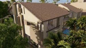 een luchtzicht op een huis met een dak bij Balinese Style Pool Villa in Goa by Amorey Stays in Anjuna