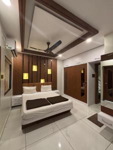 a bedroom with a large bed in a room at Hotel Hari Om in Diu