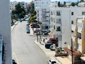 an aerial view of a city street with buildings at Central Rooms, 500m to Larnaca Marina in Larnaka +15 photos