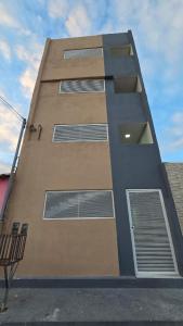 a tall building with a bunch of windows on it at Flats 1778 N102 Orla de PETROLINA in Petrolina