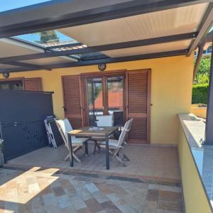 a patio with a table and chairs on it at Apartments CLIFF Piran in Piran