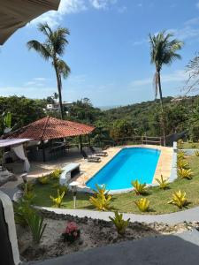 Swimmingpoolen hos eller tæt på Pousada Jardim das Bromélias