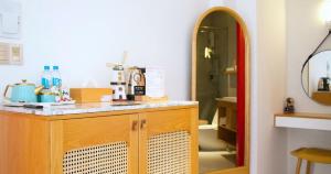 a bathroom with a counter with a coffee maker on it at Leiden Homestay&Cafe' in Ho Chi Minh City +33 photos