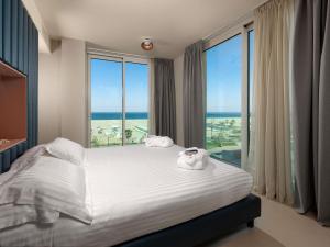 Postel nebo postele na pokoji v ubytování Mercure Hotel Rimini Artis + 96 fotografií