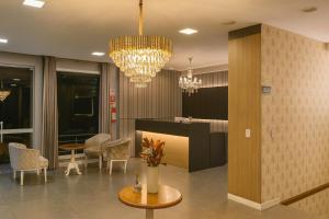 Photo de la galerie de l'établissement Eleganz Suítes Exclusive Centro, à Gramado 55 autres photos