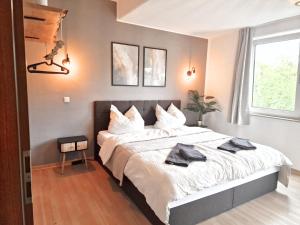 Postel nebo postele na pokoji v ubytování Central Apartment near Messe - Barrier-Free - Netflix