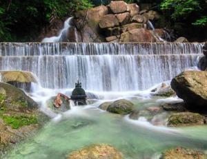 a waterfall in the middle of a river at Baiyok Villas near Kathu Waterfall in Ban Huai Luk (1) +79 photos
