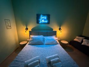 a bedroom with a bed with three pillows on it at Lodevì in Foggia +54 photos