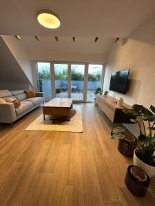 TV a/nebo společenská místnost v ubytování Möhnesee und Soest - in der Natur See&Soest