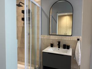 a bathroom with a sink and a mirror at 14 Wylant Street in Welgemoed +11 photos