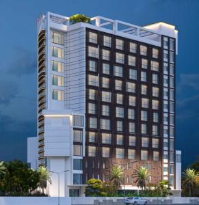 a tall building with a tree on top of it at Vivanta Kochi, Aluva in Alwaye