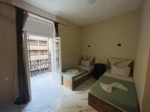 Ένα ή περισσότερα κρεβάτια σε δωμάτιο στο Star One Hotel