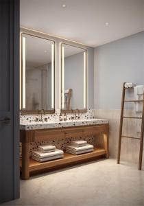 a bathroom with a sink and a mirror at The Westerly At Hilton Aruba Caribbean Resort in Palm-Eagle Beach +5 photos