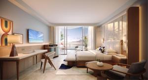 a hotel room with a bed and a desk and a room at The Westerly At Hilton Aruba Caribbean Resort in Palm-Eagle Beach