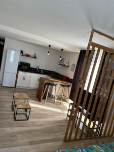 a kitchen with a table and chairs in a room at Beachfront Studio in Marigot
