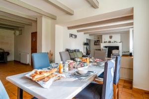 a table with bread and food on top of it at Chambre D'hôtes Nature in Cabannes