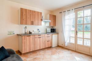 Kuchyň nebo kuchyňský kout v ubytování Le Gite au coin du feu + 20 fotografií