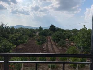 a view of a farm from a balcony at Sai Samata Lodging Boarding in Junnar