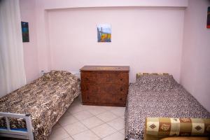 Ένα ή περισσότερα κρεβάτια σε δωμάτιο στο Luna Apartment