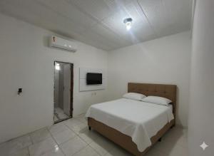 Postel nebo postele na pokoji v ubytování Hotel Gomes