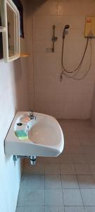 a bathroom with a sink and a shower at Babazia Community in Pai +42 photos