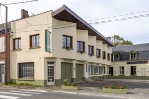 an old building on the corner of a street at Le Reflet de Valéry - Proche Plage in Le Bois de Cise