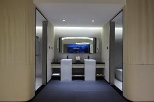 a bathroom with a sink and a mirror at Lucky house in Gaotian