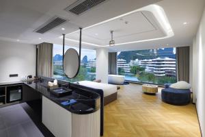a bathroom with a sink and a living room at Lucky house in Gaotian