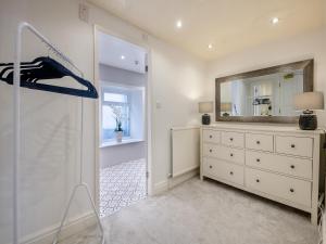 a dressing room with a dresser and a mirror at Warrington House-Uk48465 in Thornton Dale