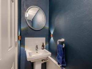 a bathroom with a sink and a mirror at Warrington House-Uk48465 in Thornton Dale +15 photos
