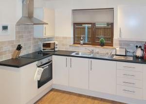 Η κουζίνα ή μικρή κουζίνα στο Heart Of Wales Lodges