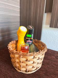 a basket with condiments in it on a table at Csilla Vendégház Remete in Remetea +9 photos