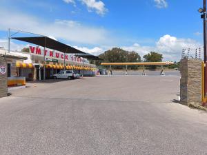 an empty parking lot in front of a building at VM Guesthouse Premium Suites in Estcourt