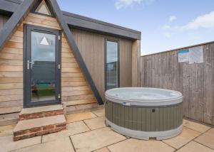 a hot tub on the patio of a house at South View Retreat in Carlton