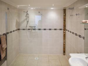 a bathroom with a shower and a sink at The Nest in Aldringham