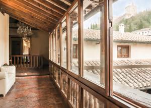 a room with windows and a view of a building at Hotel Casa 1800 Granada in Granada