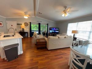 a living room with a couch and a table at Tarpon - Spacious Updated W&D Full Kitchen 1.5 Mi to Beach in Bonita Springs
