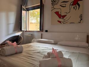 a bedroom with a bed with two towels on it at Del Console Apartment - Near Bari Airport & Station in Modugno