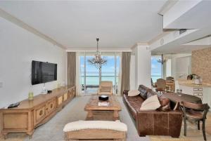 a living room with a couch and a table at Ocean & Intercoastal Views in Sunny Isles Beach