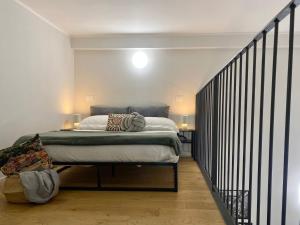 Ένα ή περισσότερα κρεβάτια σε δωμάτιο στο Loft Pellicceria