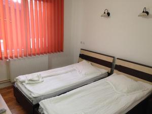 Postel nebo postele na pokoji v ubytování Hotel Romantik