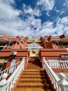 a staircase leading up to a building with a blue sky at Cielo Dorado in Santiago del Teide