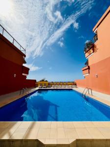 a swimming pool in the middle of a building at Cielo Dorado in Santiago del Teide