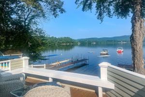 a dock on a lake with boats in the water at Four Seasons Lakehouse in Franklin