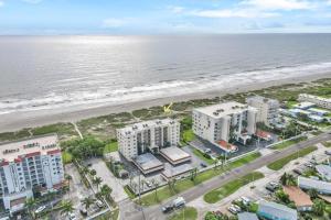 an aerial view of the beach and buildings at Sailfish Sands in Cocoa Beach